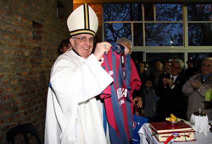 This May 24, 2011 file photo shows then cardinal Jorge Mario Bergoglio, now Pope Francis, posing with the jersey of San Lorenzo's football team, which he supports, in Buenos Aires. (AFP Photo)